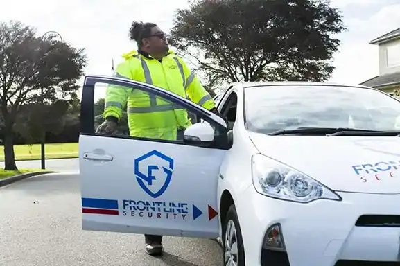 frontline security guard enter the car